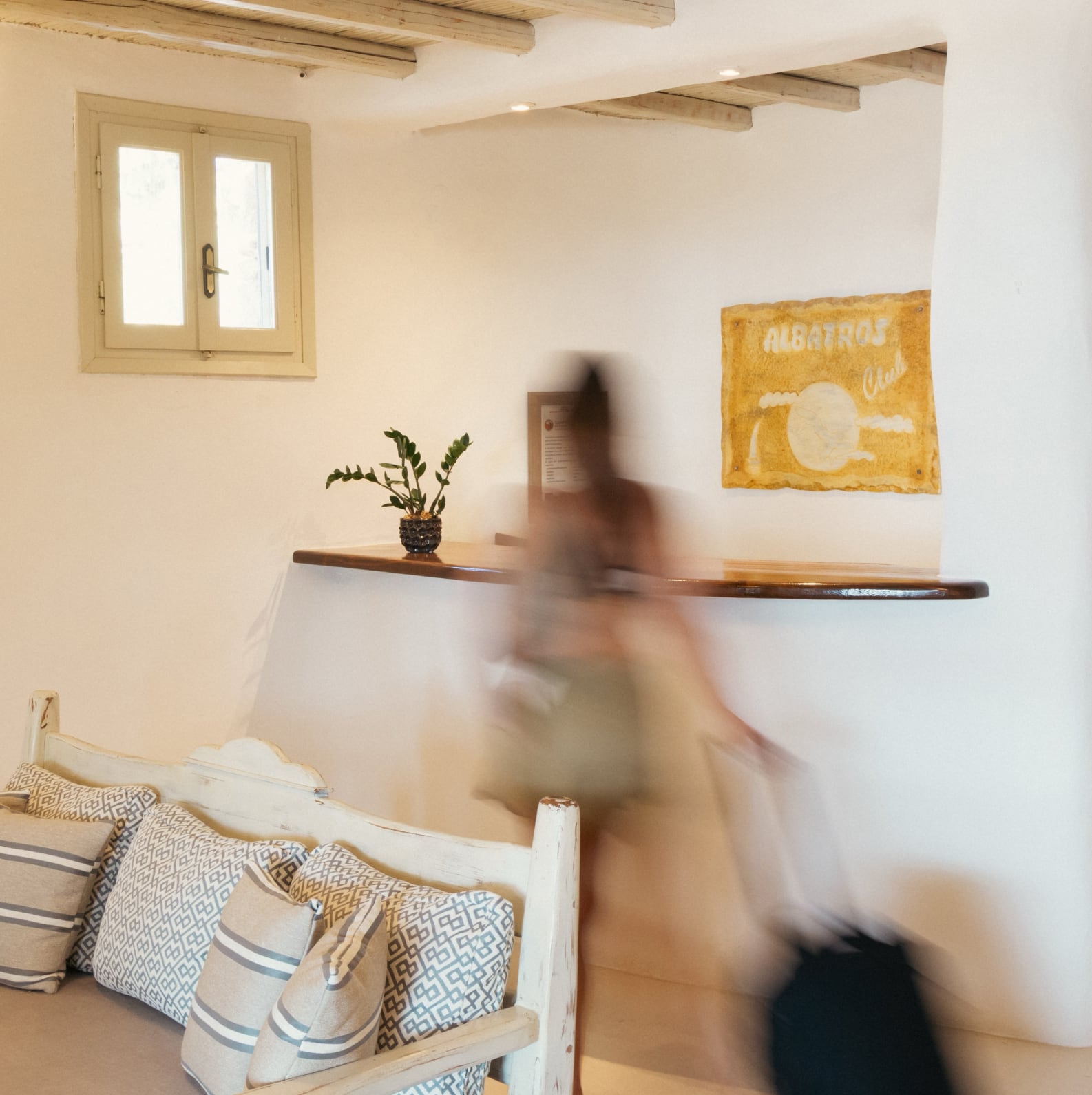 woman walking in front of the reception desk